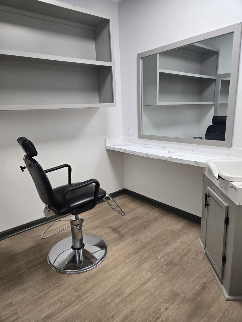 Clean styling station with chair, mirror, shelving and counter after Kidoti Clean post-construction cleaning, Birmingham AL