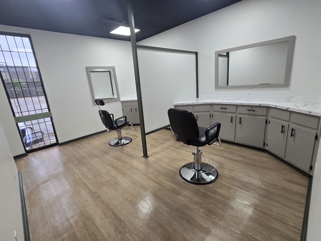 Finished salon suite with two styling chairs, mirrors and clean floors after Kidoti Clean post-construction cleaning, Birmingham AL