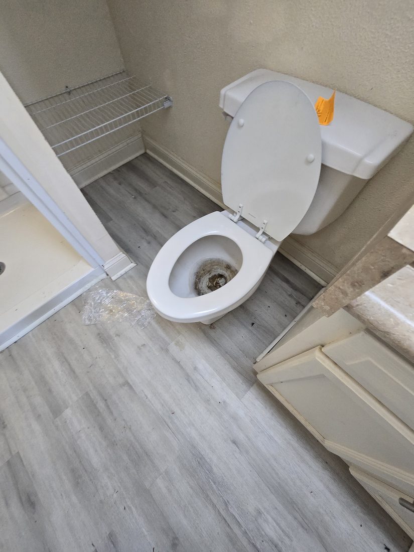 Toilet bowl with heavy mineral buildup before Kidoti Clean rehab cleaning, Birmingham AL